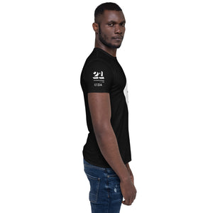 Man in jeans and black T-shirt with white Interaction 21 logo and IxDA logo on right sleeve