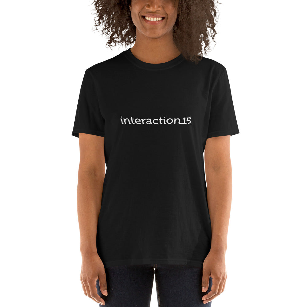 Woman in black T-shirt with white Interaction 15 logo across the front