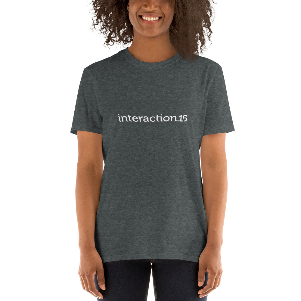 Woman in dark heather T-shirt with white Interaction 15 logo across the front