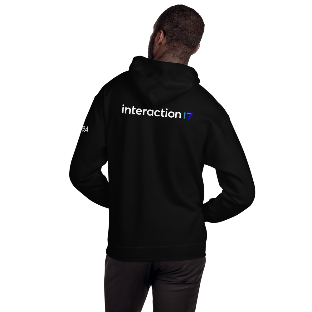 Man in black hoodie from the back with blue, purple and white Interaction 17 logo across back and white IxDA logo on left sleeve