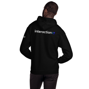 Man in black hoodie from the back with blue, purple and white Interaction 17 logo across back and white IxDA logo on left sleeve
