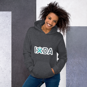 Woman wearing dark heather hoodie with grey and teal IxDA letters outlined in white