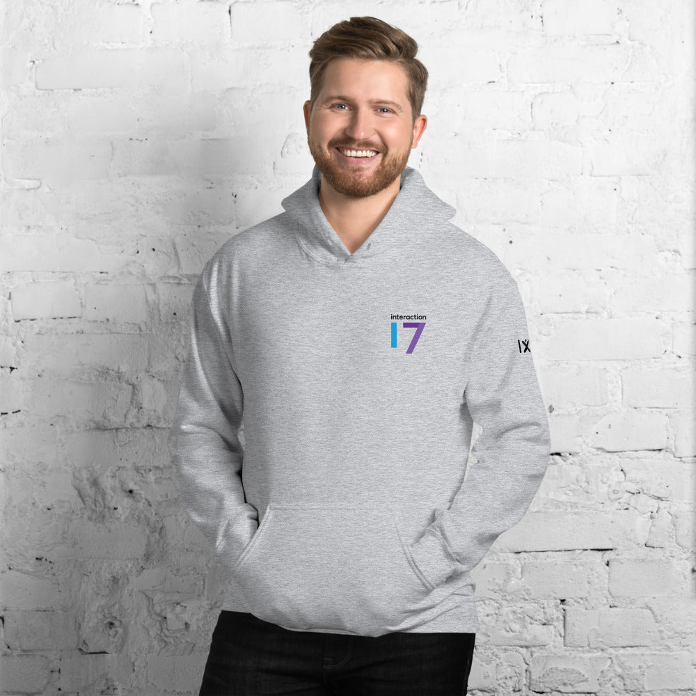 Man in sport grey hoodie with blue, purple and black Interaction 17 logo on left front