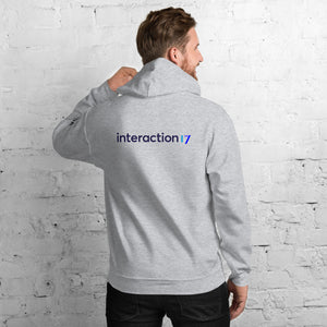 Man in sport grey hoodie with blue, purple and black Interaction 17 logo across the back